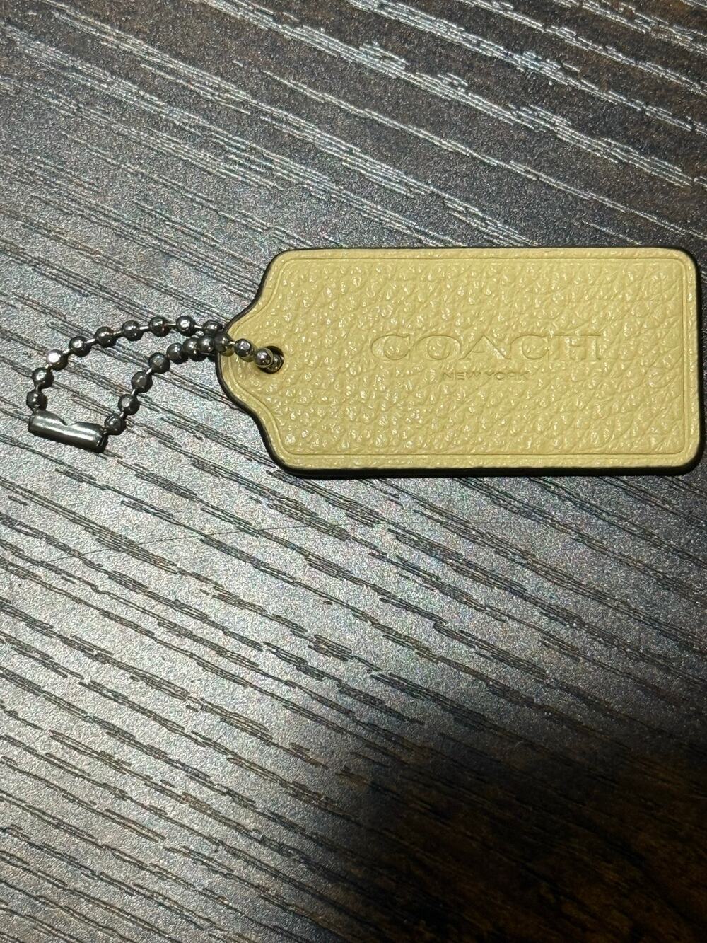 Coach Light Yellow Pale Cream Pebbled Leather Hangtag New York Logo